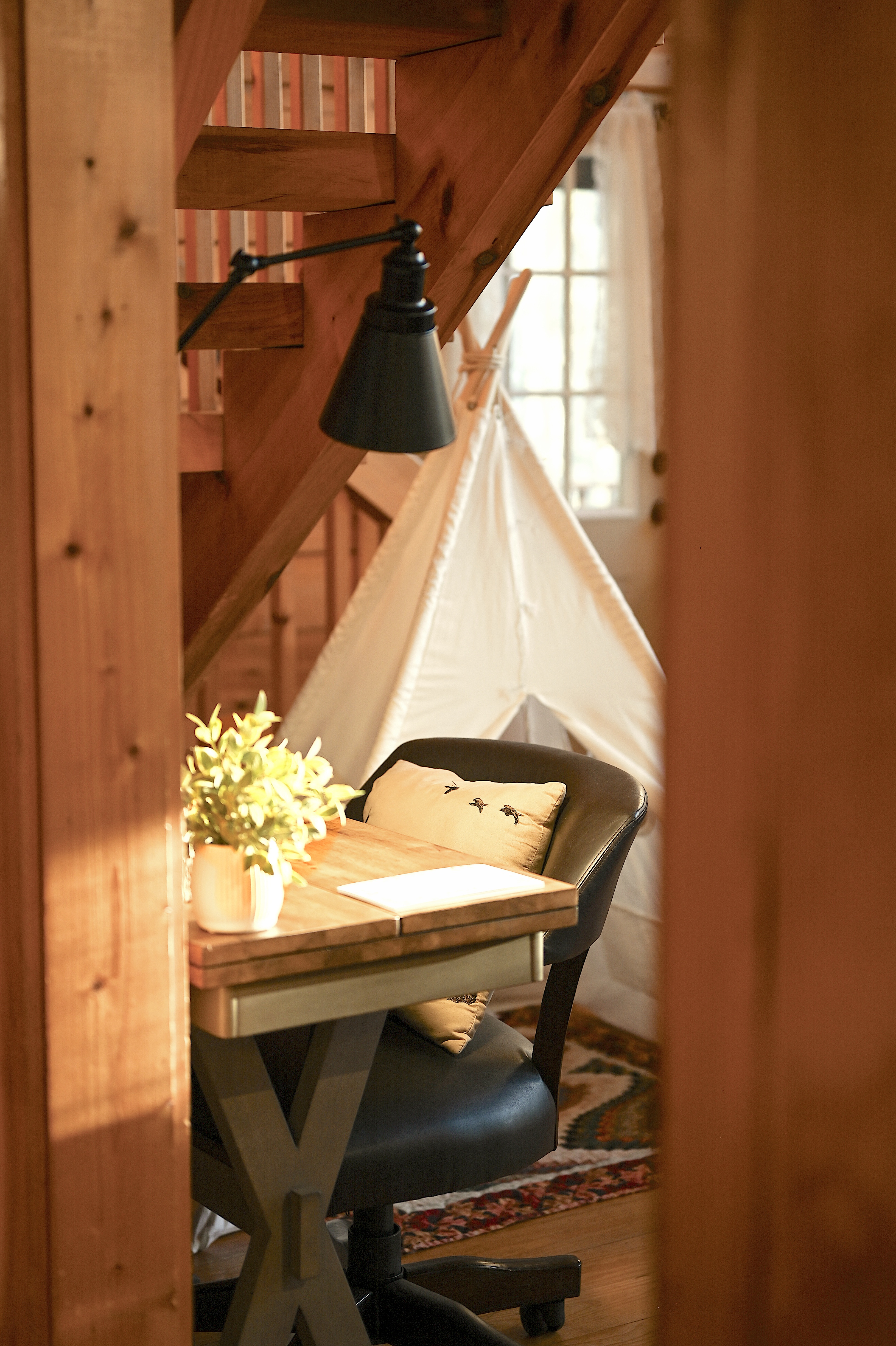 Charming workspace nook under the stairs