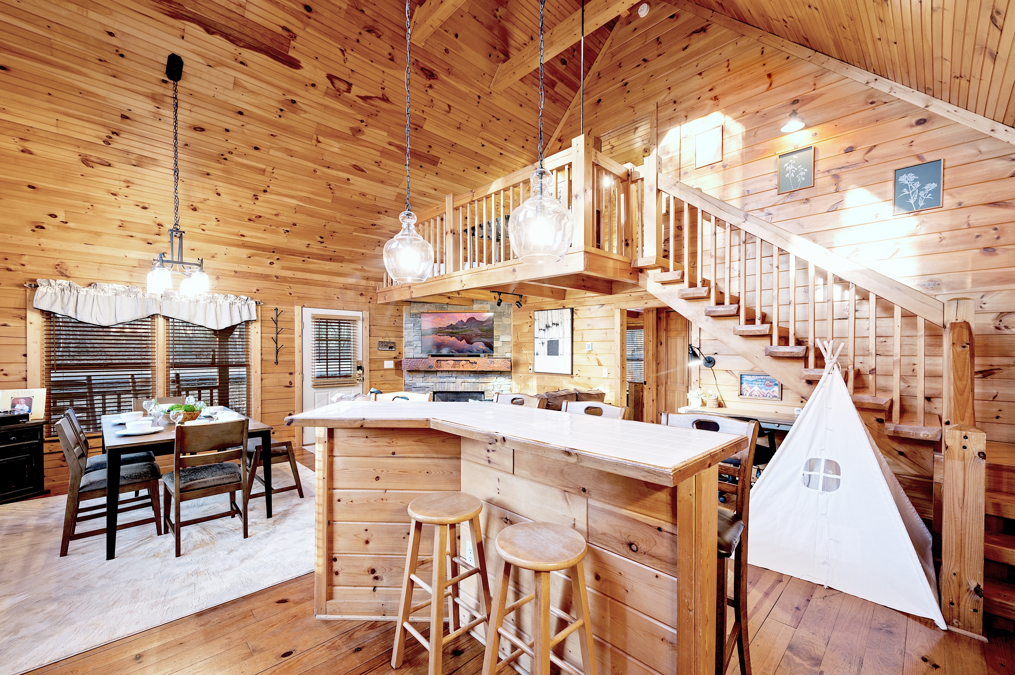 Full kitchen with bar seating and vaulted ceiling