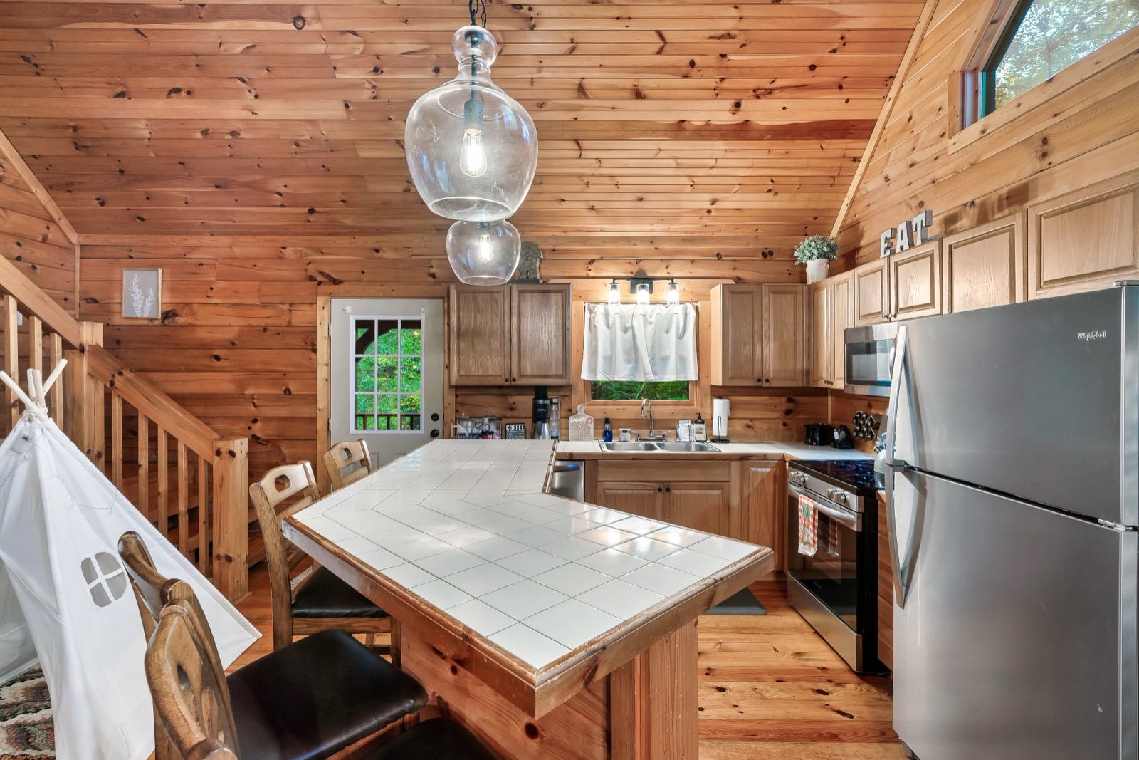 Kitchen and dining area with vaulted ceiling