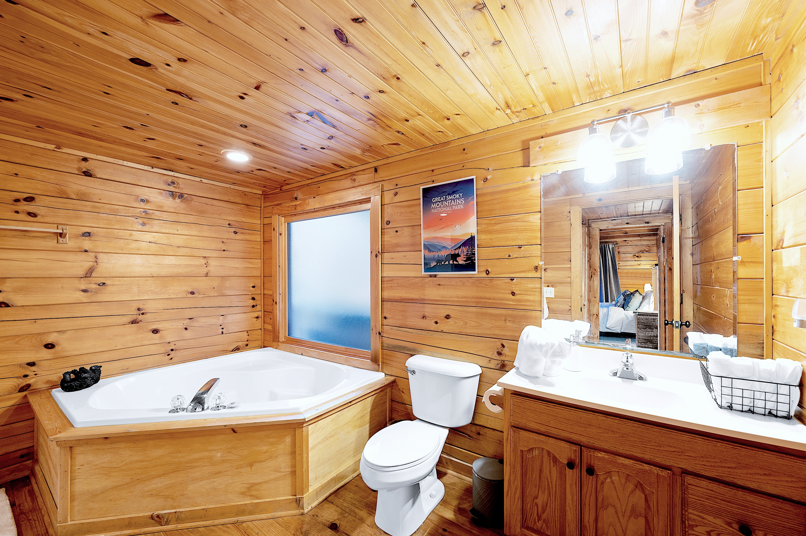 Master bathroom with jacuzzi and Smoky Mountains art